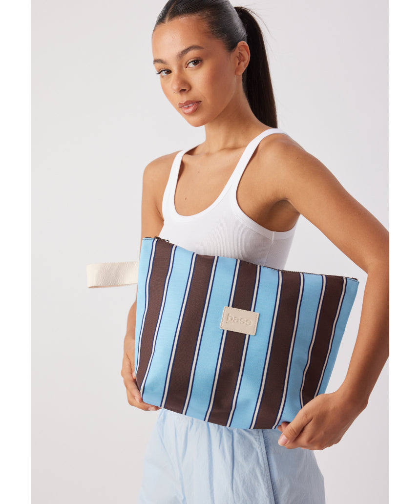 Large wet base from Base in chocolate stripe with a smooth, glossy finish and vibrant pattern.