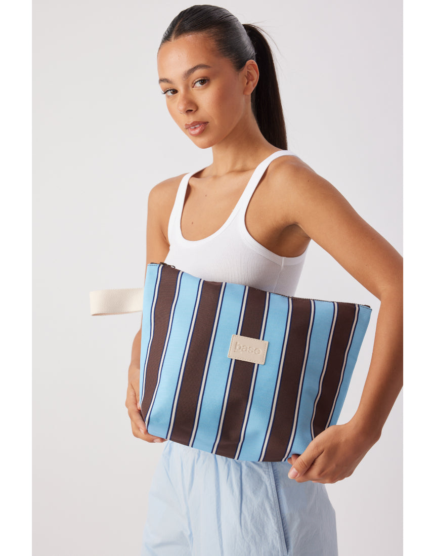Large wet base from Base in chocolate stripe with a smooth, glossy finish and vibrant pattern.