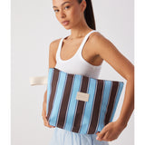 Large wet base from Base in chocolate stripe with a smooth, glossy finish and vibrant pattern.