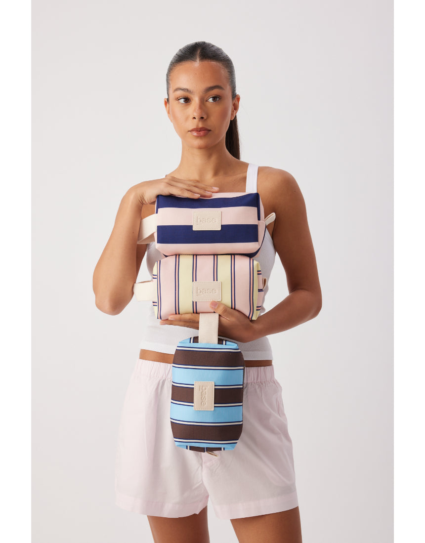 Base Ditty Base in Regatta Stripe, a stylish and durable surfboard base with vibrant blue and white striped design.