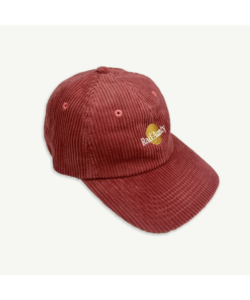 Banabae Rad Aunty Cord Cap in eco-friendly red fabric, featuring a classic baseball style with a curved brim and adjustable strap.