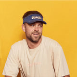 Banabae Super Star Coach Visor featuring a wide brim and adjustable strap, perfect for outdoor activities and sun protection.