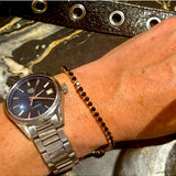 Salty Safari Oslo bracelet featuring sea-inspired beads and nautical charms on a woven cord, natural and stylish jewelry accessory.