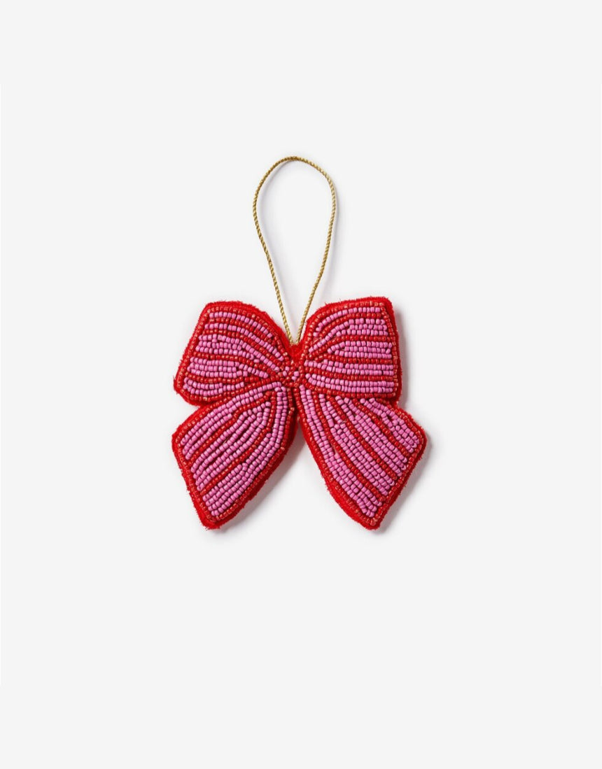 Pink beaded bow Christmas decoration by Bonnie and Neil, festive holiday ornament with intricate beadwork and soft pink color.