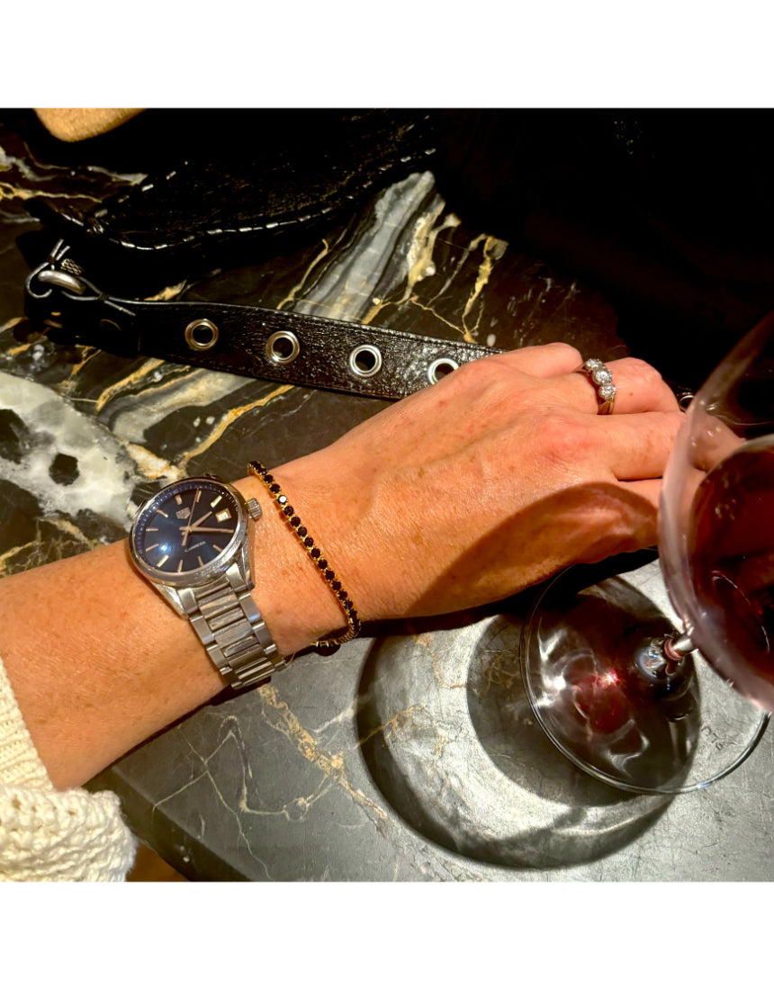 Salty Safari Oslo bracelet featuring nautical-inspired design with beads and charms in a natural color palette.