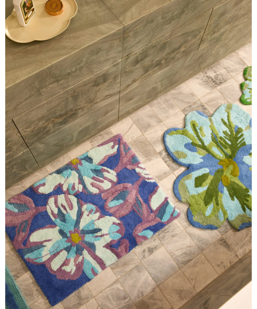 Blue Dutch floral bath mat by Bonnie and Neil, featuring a charming floral pattern, perfect for bathroom decor.