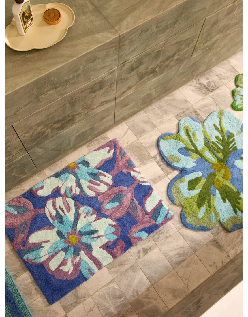 Blue Dutch floral bath mat by Bonnie and Neil, featuring a charming floral pattern, perfect for bathroom decor.