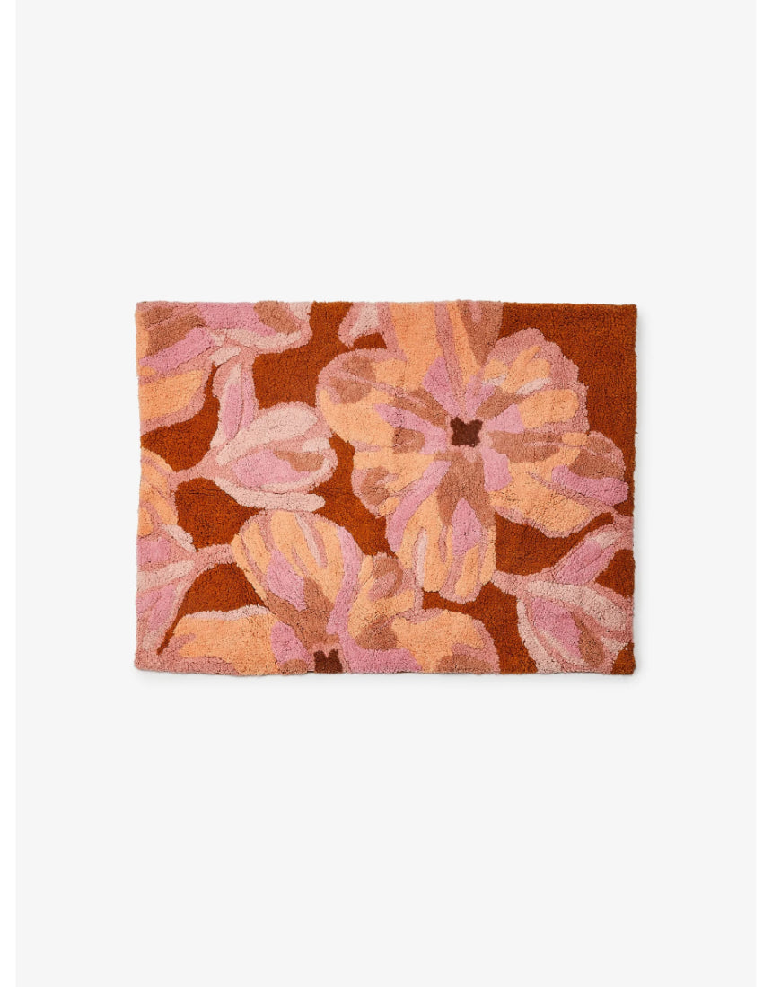 Pink Dutch floral Bonnie and Neil bath mat with a decorative floral pattern, ideal for bathroom decor.