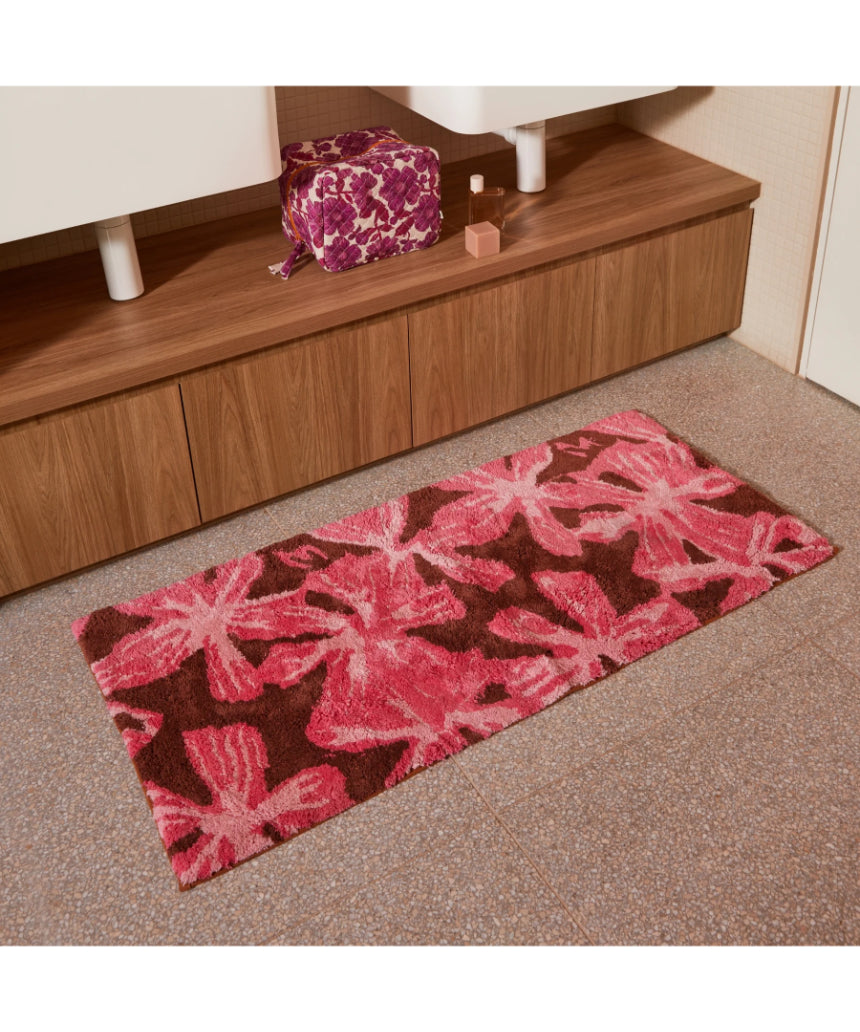 Pink cotton bath mat by Bonnie and Neil with a soft, plush texture, perfect for adding comfort to your bathroom.