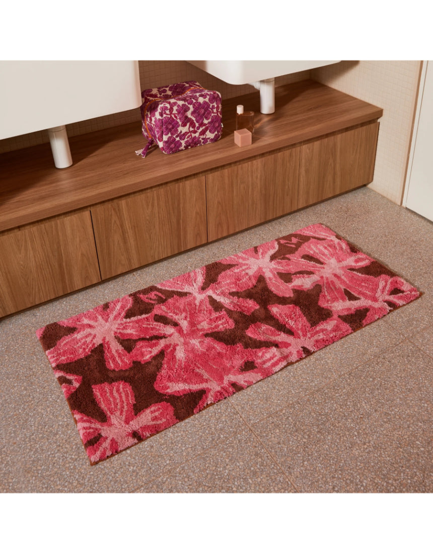 Pink cotton bath mat by Bonnie and Neil with a soft, plush texture, perfect for adding comfort to your bathroom.