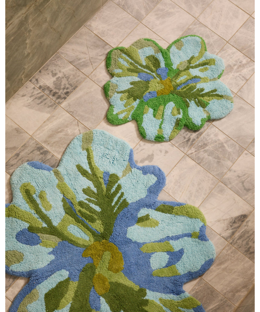 Bonnie and Neil Tulip Blue Green bath mat with floral design, soft fabric, and non-slip backing for bathroom decor.