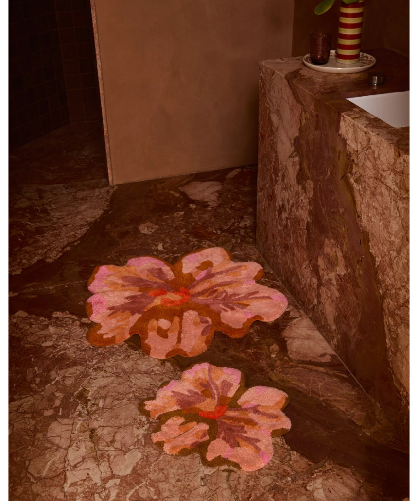 Bonnie and Neil Mini Tulip Tan bath mat with a soft, textured surface, styled in a bathroom setting.