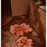 Bonnie and Neil Mini Tulip Tan bath mat with a soft, textured surface, styled in a bathroom setting.