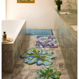 Blue and green tulip-patterned bath mat by Bonnie and Neil, styled in a bathroom setting, soft cotton texture and decorative design.