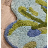 Bonnie and Neil Tulip Blue Green bath mat with floral pattern, soft fabric, and non-slip backing for bathroom decor.