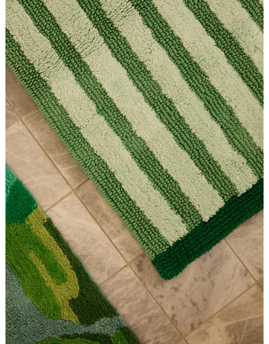 Reversible green stripe bath mat by Bonnie and Neil, featuring bold stripes and soft, absorbent fabric for bathroom decor.