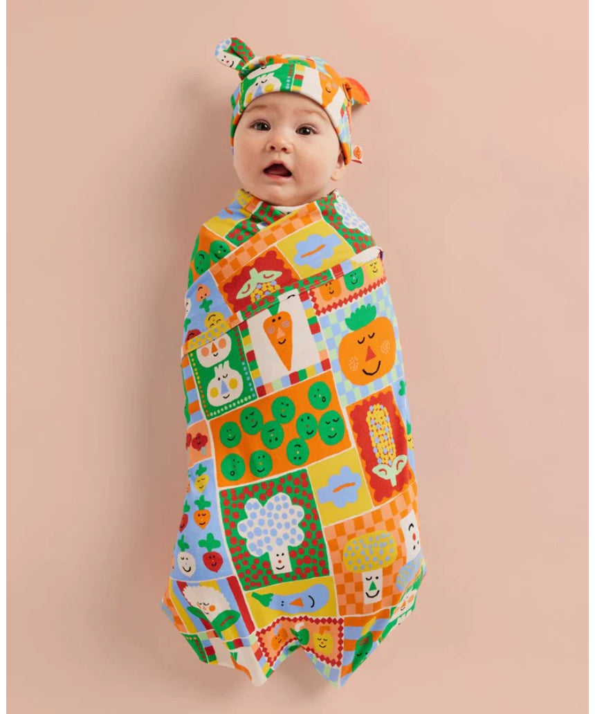 Halcyon Nights pocket patch baby hat with colorful patch design, soft fabric, and snug fit for newborns and infants.