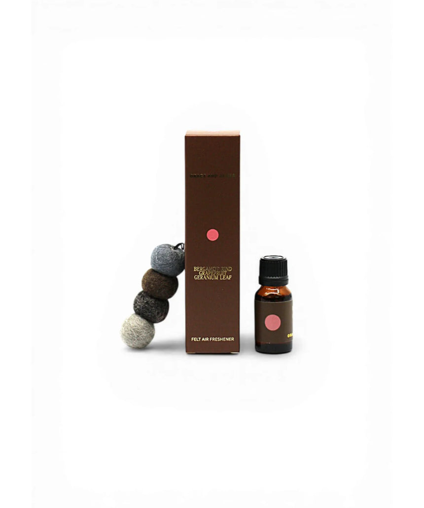 Grace & James Forager air freshener featuring bergamot rind, grapefruit, and geranium in a sleek bottle.