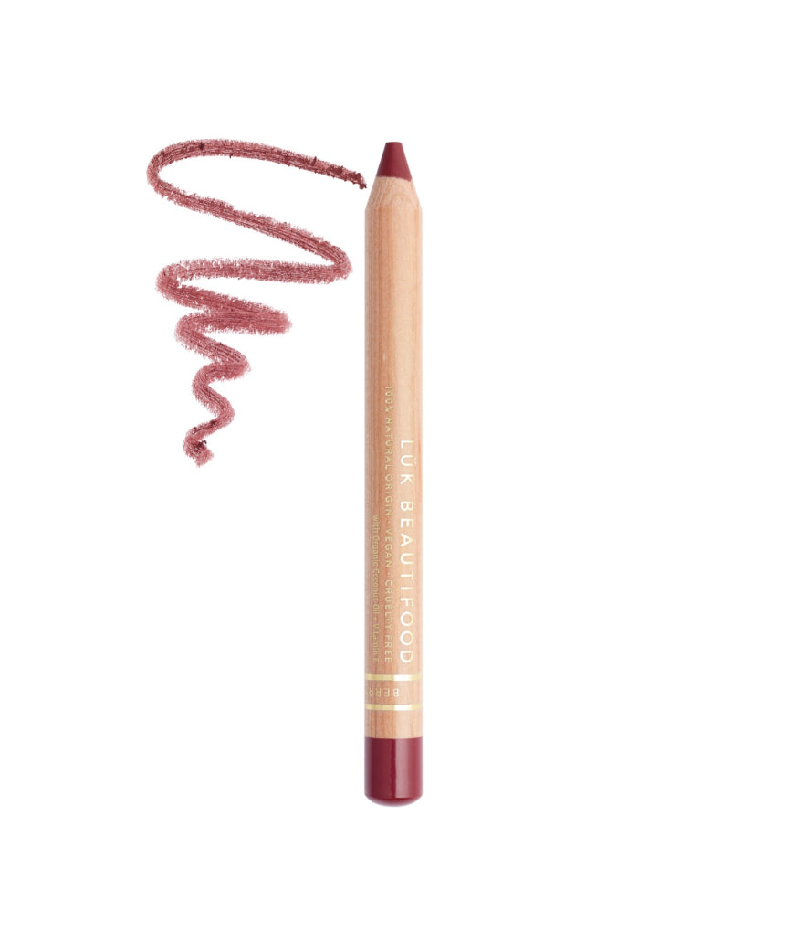 Lük Beautifood Natural Lipstick Crayon in Berry Bite swatched on skin showing deep berry color and creamy texture.