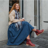 Merry People Bobbi gumboots in brick red, stylish waterproof footwear with a sleek design, perfect for rainy weather.