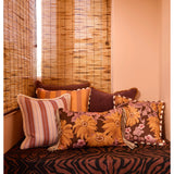 Bonnie and Neil marigold amber linen cushion, 50cm, styled for living room decor with vibrant floral pattern.