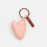 Heart-shaped peach key ring from Scarpa Imports with a colorful, glossy finish and metal keyring attachment.