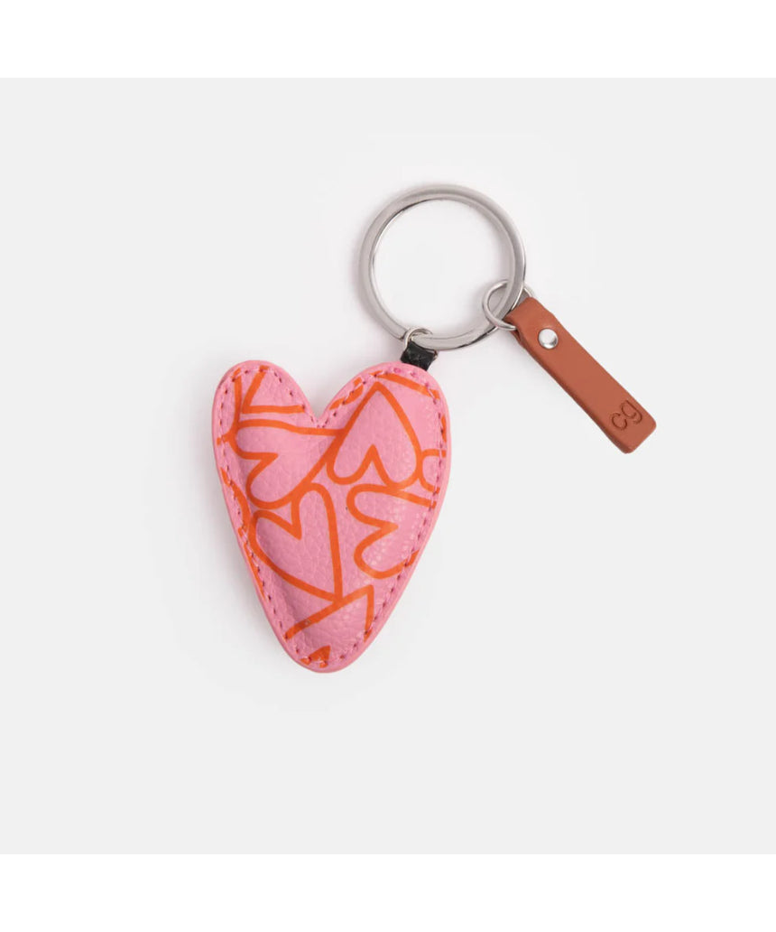Pink heart-pattern key ring from Scarpa Imports with a decorative pink and white design, ideal for holding keys or as a accessory.
