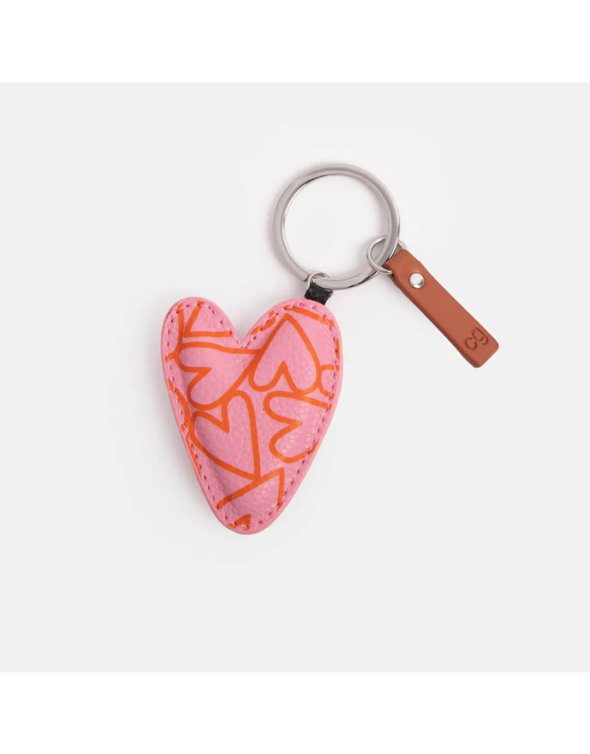 Pink heart-pattern key ring from Scarpa Imports with a decorative pink and white design, ideal for holding keys or as a accessory.