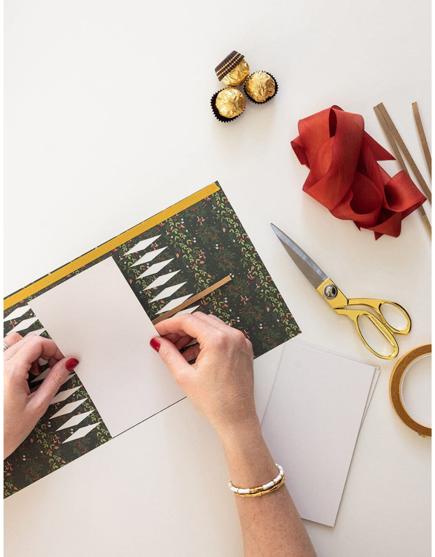 Bespoke Letterpress 10-pack Jolly Santa Christmas cracker kit with festive holiday decorations and detailed paper craftsmanship.