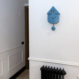 Blue Fisura cuckoo clock with a wooden case and traditional design, featuring a small cuckoo bird and clock face.