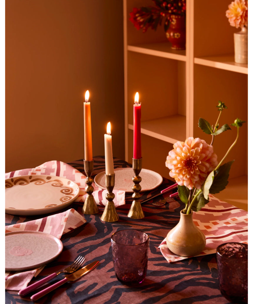 Set of three brass candle holders by Bonnie and Neil, decorative vintage-style holders with intricate design details.