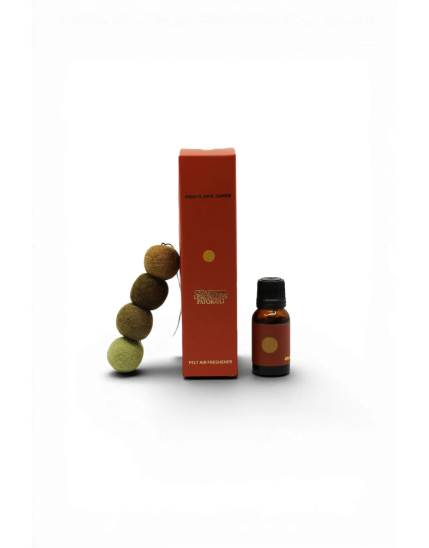Grace & James Cedarwood, Lemongrass, and Patchouli air freshener bottle with natural scent blend.