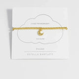 Gold-plated Estella Bartlett CZ moon stretch bracelet featuring a delicate celestial design on a jewelry image.