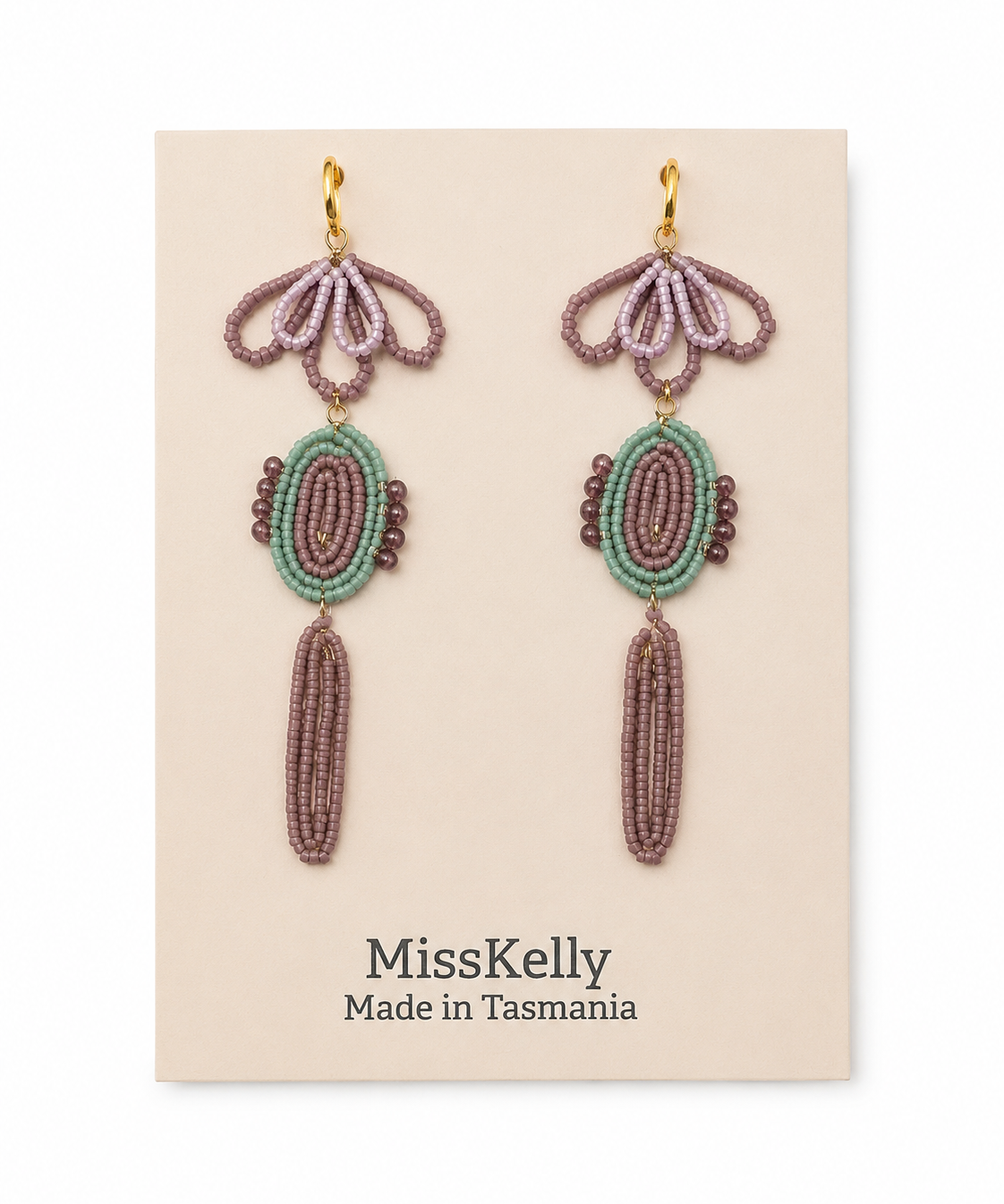 Miss Kelly Madison statement earrings featuring bold, modern design with gold-tone accents and intricate detailing.