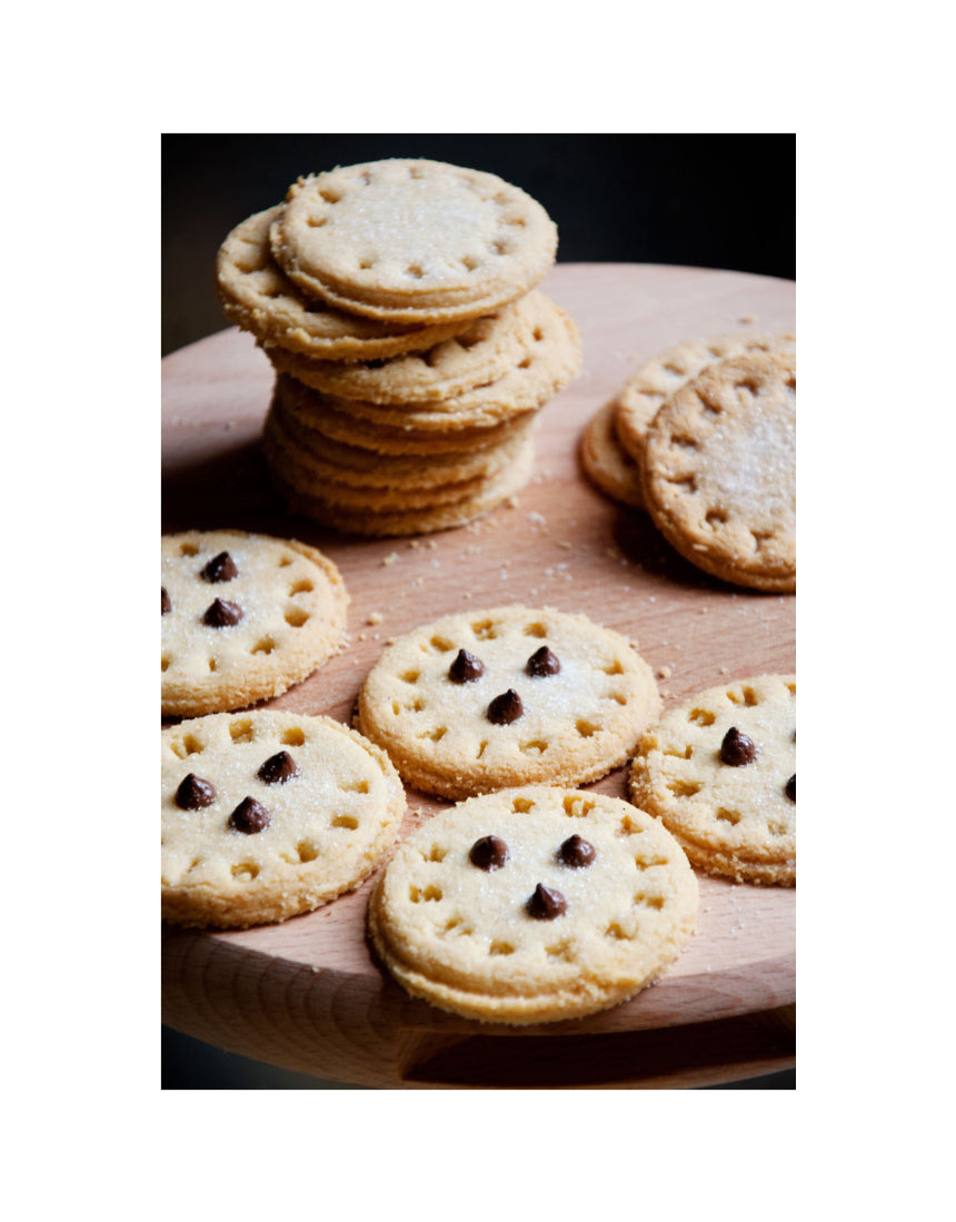 Suck UK customizable cookie stamp with wooden handle and engraved design for personalized baking cookies.