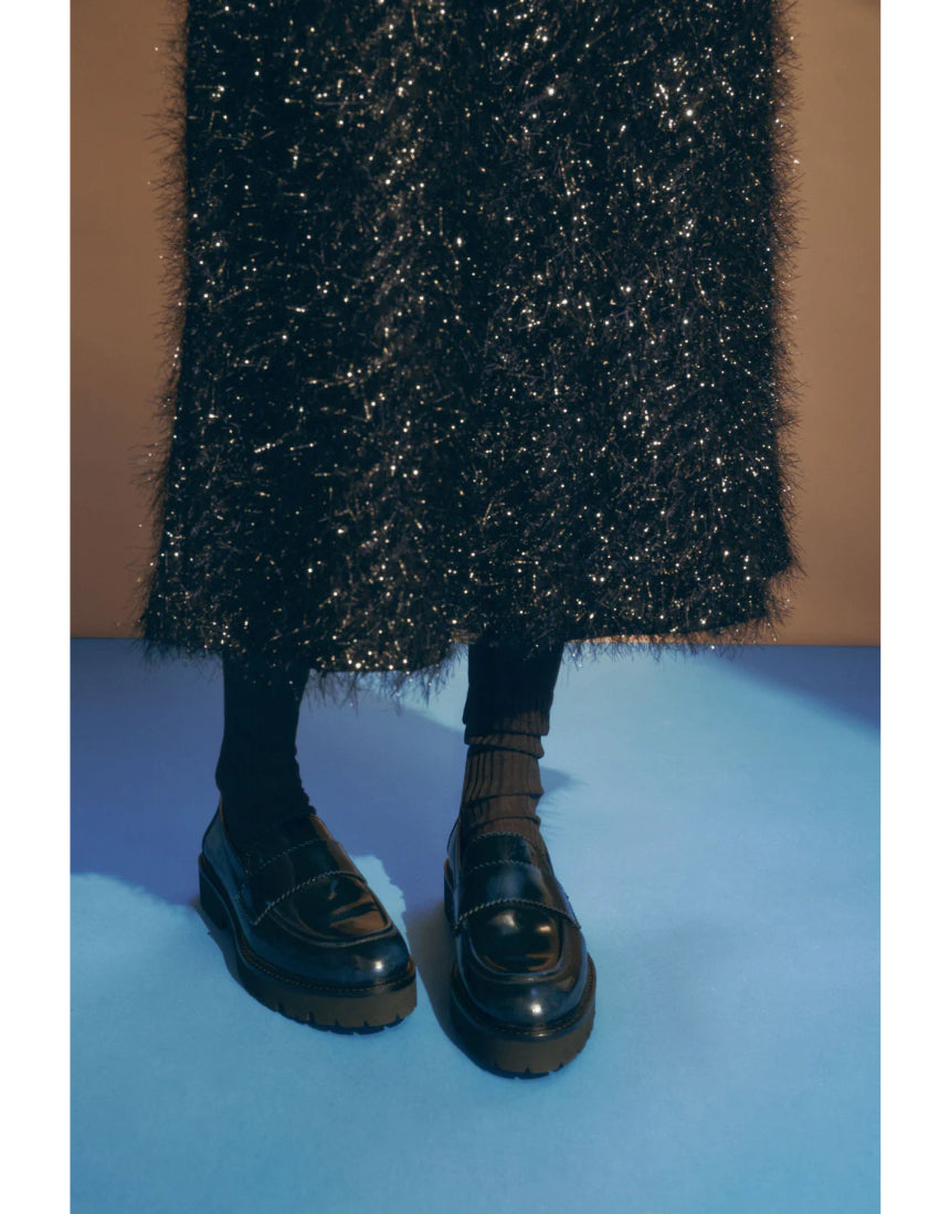 Elk Ilta skirt in a stylish design, featuring a flowing silhouette and detailed fabric, perfect for versatile fashion looks.