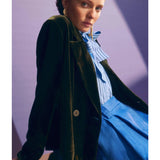 Deep olive Elk Suuri double-breasted blazer hanging on a wooden hanger, showcasing tailored collar and sleek design.