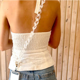 Clear Capri phone strap accessory by Salty Safari featuring adjustable strap and durable materials for secure phone carrying.