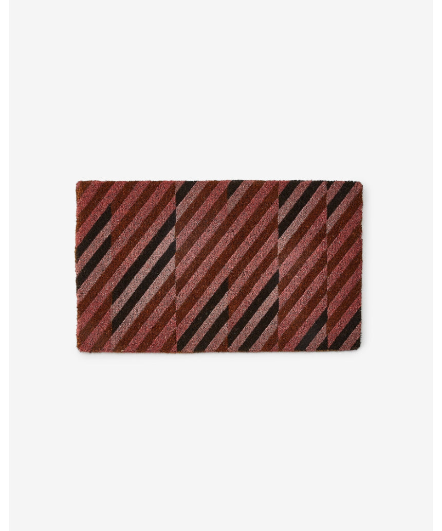Pink patchwork door mat by Bonnie and Neil with floral and geometric patterns, perfect for welcoming entryways.