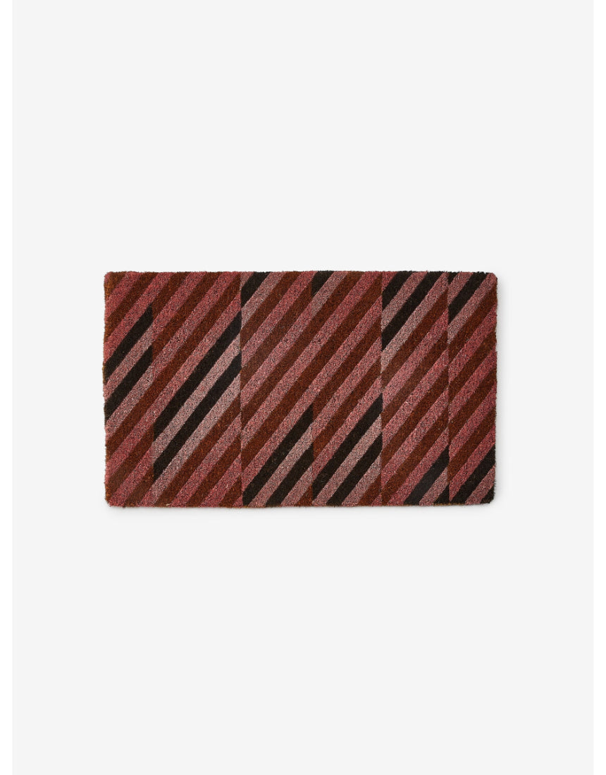 Pink patchwork door mat by Bonnie and Neil with floral and geometric patterns, perfect for welcoming entryways.