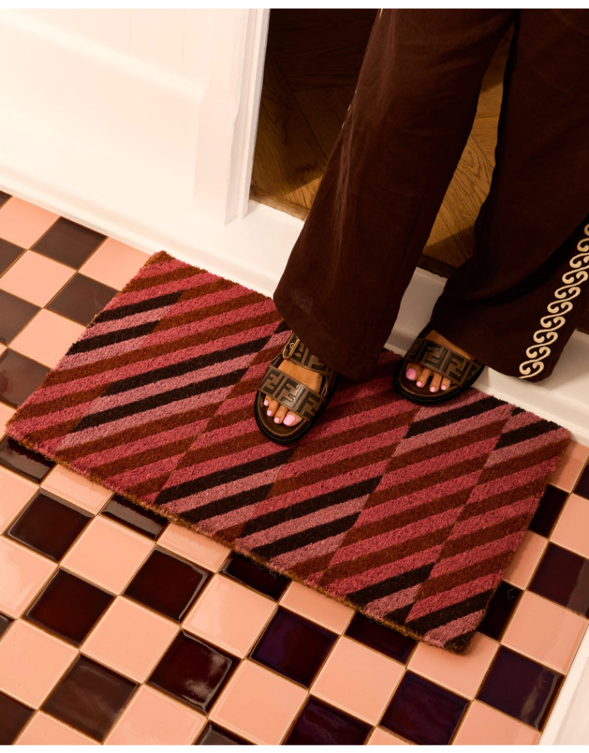 Bonnie and Neil patchwork pink door mat with colorful geometric pattern for welcoming entryway decor.