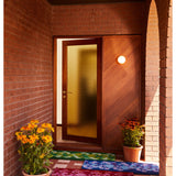 Pink coir door mat featuring a pansy flower design by Bonnie and Neil, ideal for welcoming entryways.