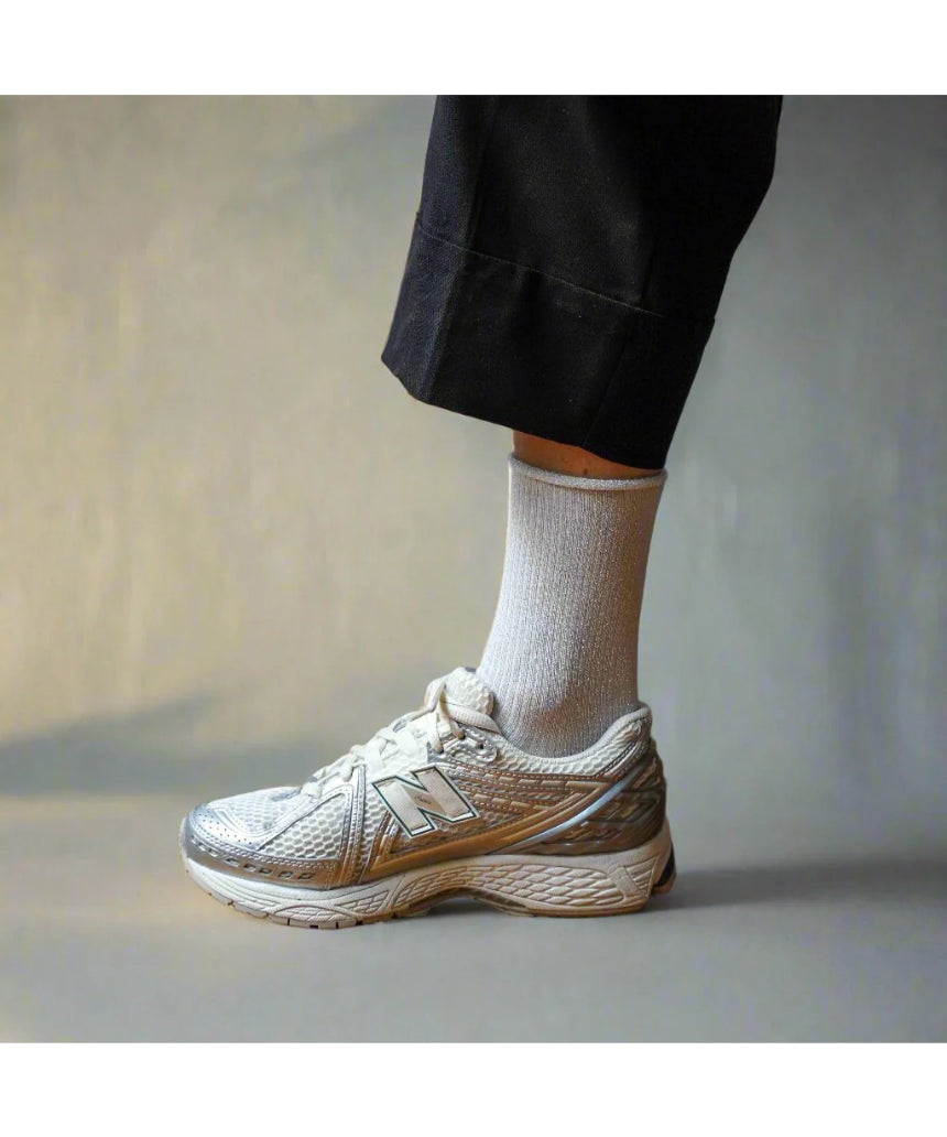 White glitter lurex socks by Klue, showcasing shiny, textured fabric and comfortable fit, perfect for stylish casual wear.