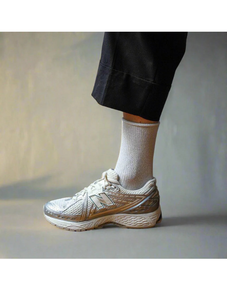 White glitter lurex socks by Klue, showcasing shiny, textured fabric and comfortable fit, perfect for stylish casual wear.