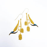 Denz Blue Faced Honeyeater earrings with honey, blue, and black feathers and metal hooks, showcasing vibrant, nature-inspired jewelry.