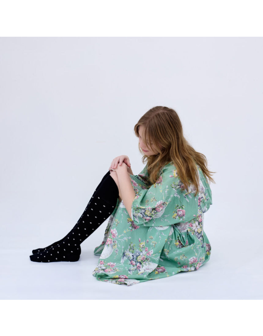 Black Dotty Merino Wool Socks by Tightology featuring colorful dotted pattern and soft, warm knit fabric.