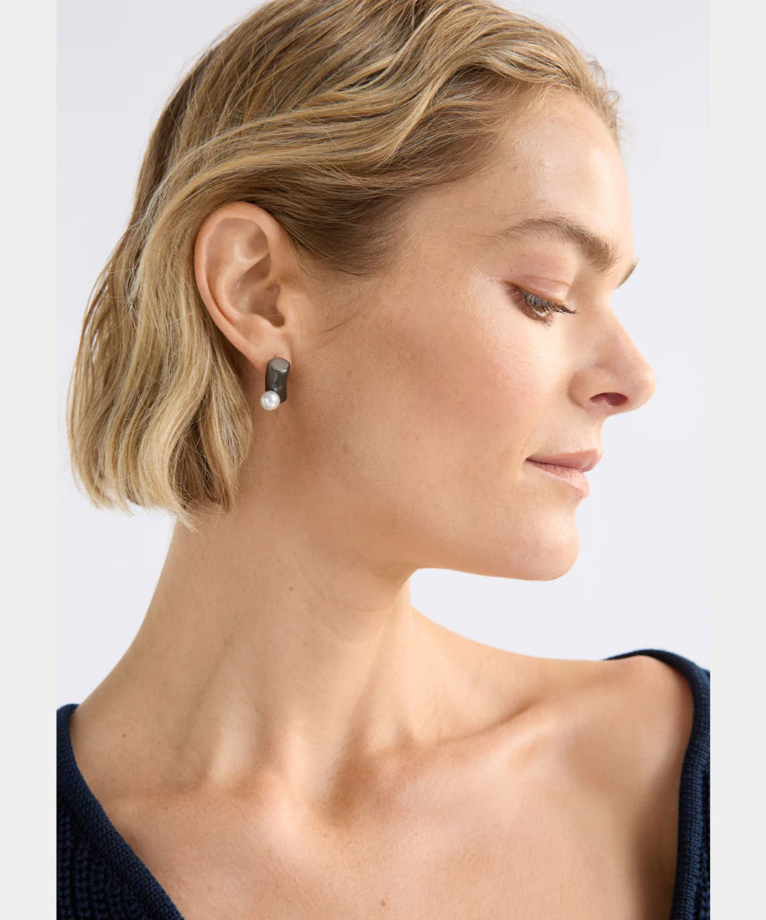 Gunmetal Elk Ahas Stud Earring featuring a small, round design with a smooth finish and subtle brand logo detail.