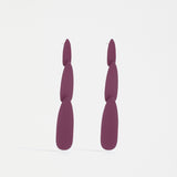 Pink berry Elk Niiv earrings with sleek design and gold accents, perfect for stylish accessories.