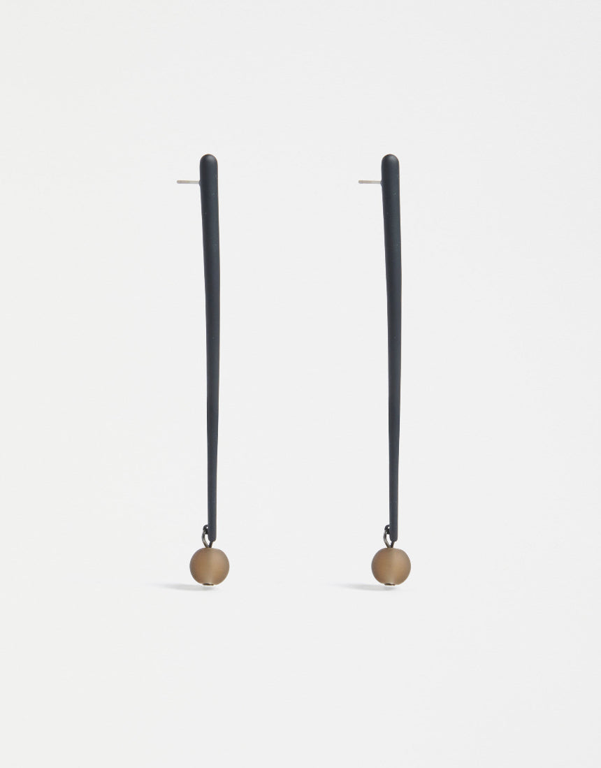 Elk Kyna Zinc earrings featuring sleek, minimalist design with silver-tone finish, hanging from delicate hooks.