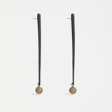 Elk Kyna Zinc earrings featuring sleek, minimalist design with silver-tone finish, hanging from delicate hooks.